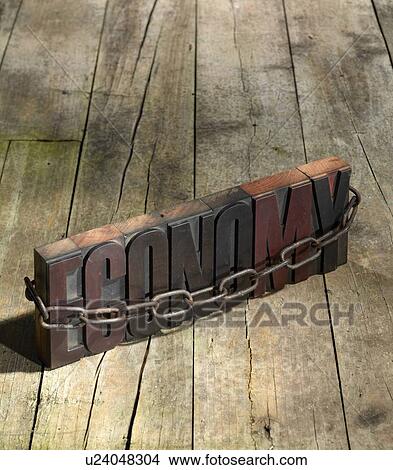 Picture - Blocks spelling economy in chains. Fotosearch