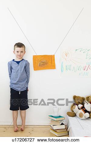Boy with drawings on bedroom wall View Large Photo Image Stock Photo - Boy with drawings on bedroom wall. Fotosearch