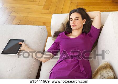 Stock Photo - Businesswoman holding tablet computer. Fotosearch