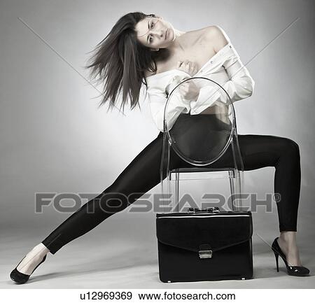 Stock Photo - Businesswoman sitting in plastic chair. Fotosearch
