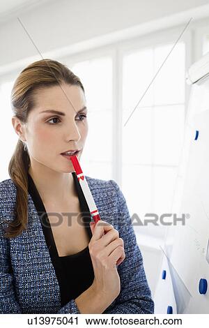Businesswoman thinking at whiteboard View Large Photo Image Stock Image - Businesswoman thinking at whiteboard. Fotosearch