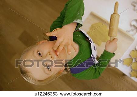 Child licking fingers while cooking View Large Photo Image Stock Image - Child licking fingers while cooking. Fotosearch