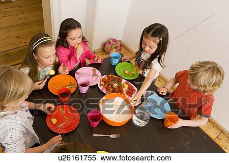Children dipping vegetables in sauce View Large Photo Image Stock Photography - Children dipping vegetables in sauce. Fotosearch