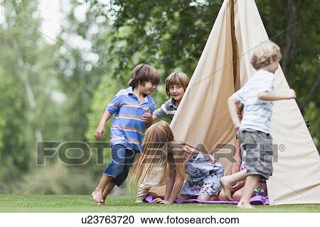 Children playing in tent outdoors View Large Photo Image Stock Image - Children playing in tent outdoors. Fotosearch