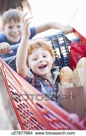 Children playing with shopping cart View Large Photo Image Picture - Children playing with shopping cart. Fotosearch