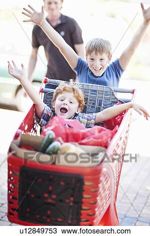 Children playing with shopping cart View Large Photo Image Stock Image - Children playing with shopping cart. Fotosearch