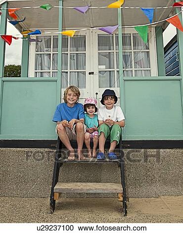 Children sitting on front steps together View Large Photo Image Stock Image - Children sitting on front steps together. Fotosearch