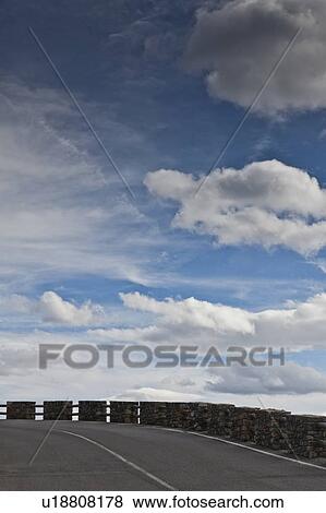 Cliff road against blue sky View Large Photo Image Stock Photo - Cliff road against blue sky. Fotosearch