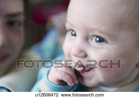 Close up of babys smiling face View Large Photo Image Stock Image - Close up of babys smiling face. Fotosearch