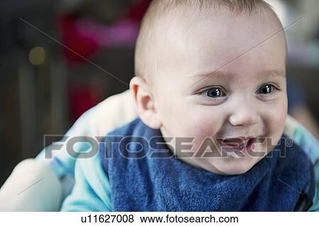 Close up of babys smiling face View Large Photo Image Stock Photo - Close up of babys smiling face. Fotosearch