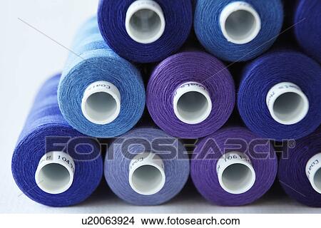 Close up of blue spools of thread View Large Photo Image Picture - Close up of blue spools of thread. Fotosearch