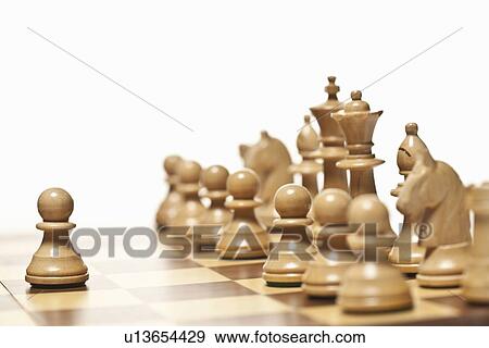 Close up of chess pieces on board View Large Photo Image Stock Photo - Close up of chess pieces on board. Fotosearch