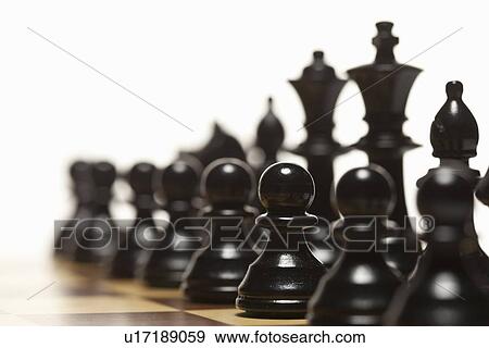Stock Photo - Close up of chess pieces on board. Fotosearch