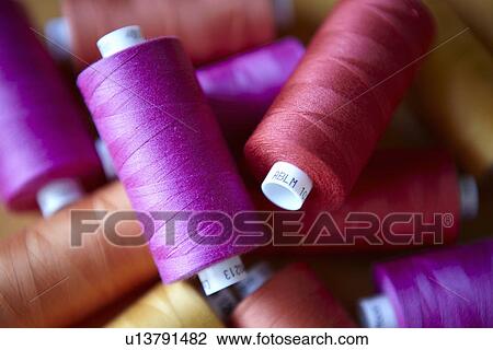 Close up of colorful spools of thread View Large Photo Image Stock Image - Close up of colorful spools of thread. Fotosearch