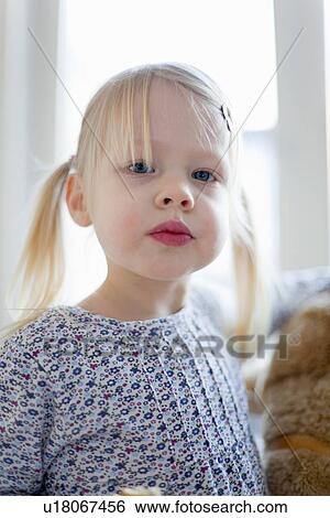 Stock Photograph - Close up of girls face. Fotosearch