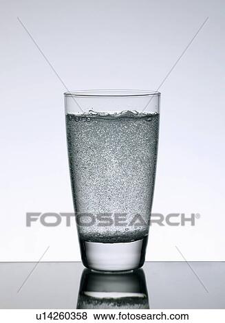 Stock Photo - Close up of glass of sparkling water. Fotosearch