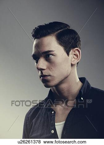 Stock Photo - Close up of mans serious face. Fotosearch