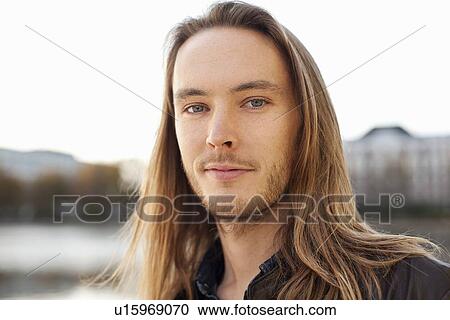 Stock Image - Close up of mans smiling face. Fotosearch
