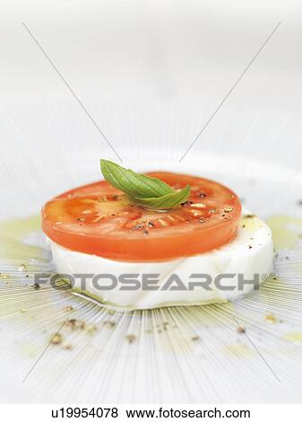 Close up of plate of caprese salad View Large Photo Image Stock Photo - Close up of plate of caprese salad. Fotosearch