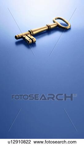 Stock Image - Close up of skeleton key on counter. Fotosearch