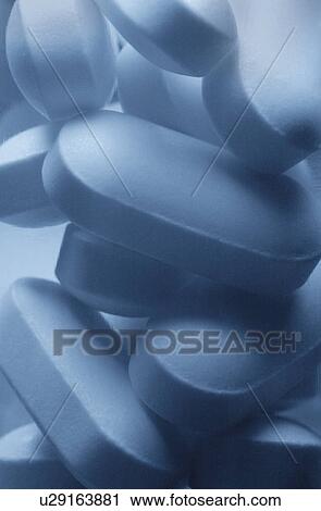 Stock Image - Close up of Vicodin pills. Fotosearch