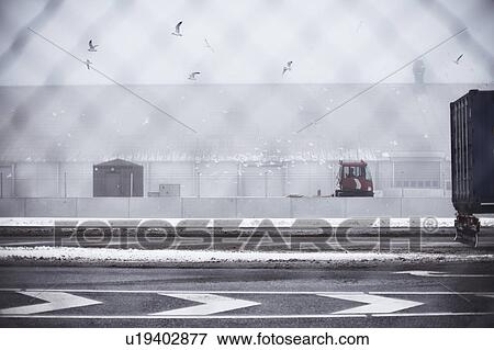 Stock Photo - Containers in snowy harbor. Fotosearch