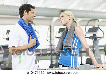 Couple talking in gym View Large Photo Image Stock Image - Couple talking in gym. Fotosearch