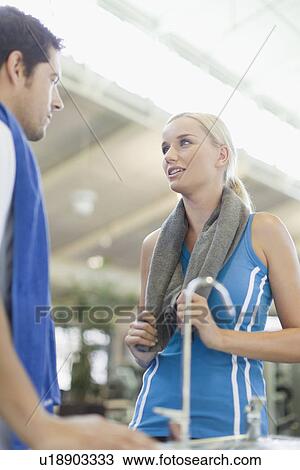 Couple talking in gym View Large Photo Image Stock Image - Couple talking in gym. Fotosearch