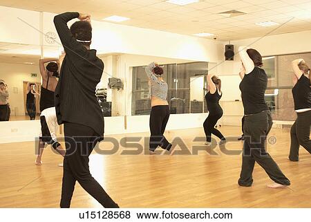 Dancers rehearsing together in studio View Large Photo Image Stock Photo - Dancers rehearsing together in studio. Fotosearch