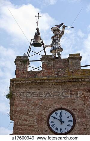 Stock Photo - Dilapidated statue on clock tower. Fotosearch