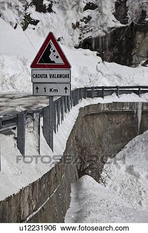 Falling rocks sign in snowy landscape View Large Photo Image Stock Photograph - Falling rocks sign in snowy landscape. Fotosearch