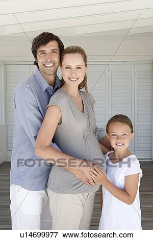 Stock Photo - Family smiling together. Fotosearch