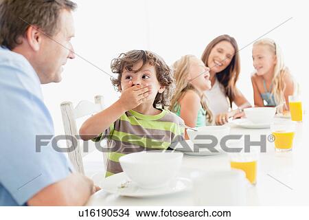 Family talking at breakfast table View Large Photo Image Picture - Family talking at breakfast table. Fotosearch