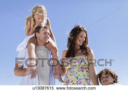 Family walking together on beach View Large Photo Image Stock Photography - Family walking together on beach. Fotosearch