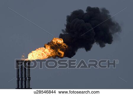 Fire pouring from industrial smokestacks View Large Photo Image Picture - Fire pouring from industrial smokestacks. Fotosearch