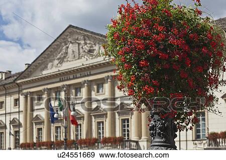 Stock Photo - Flowers growing on city lamp post. Fotosearch
