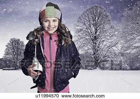 Girl carrying sneaker in snow View Large Photo Image Stock Image - Girl carrying sneaker in snow. Fotosearch