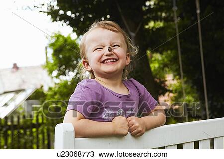 Girl holding snail on nose View Large Photo Image Stock Image - Girl holding snail on nose. Fotosearch
