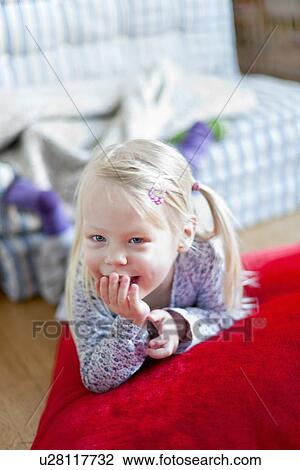 Girl laughing on pillow View Large Photo Image Stock Image - Girl laughing on pillow. Fotosearch