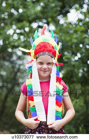 Girl wearing Indian headdress View Large Photo Image Stock Photo - Girl wearing Indian headdress. Fotosearch
