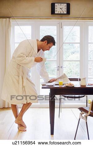 Man in bathrobe having breakfast View Large Photo Image Picture - Man in bathrobe having breakfast. Fotosearch