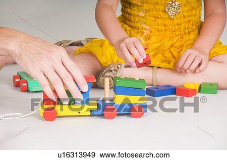 Stock Photo - Mother and daughter playing together. Fotosearch