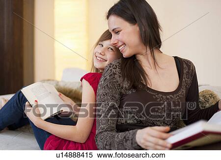 Stock Photography - Mother and daughter reading separately. Fotosearch