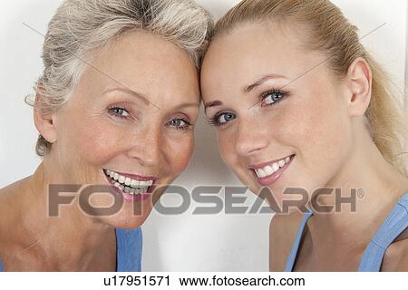 Mother and daughter smiling together View Large Photo Image Stock Image - Mother and daughter smiling together. Fotosearch