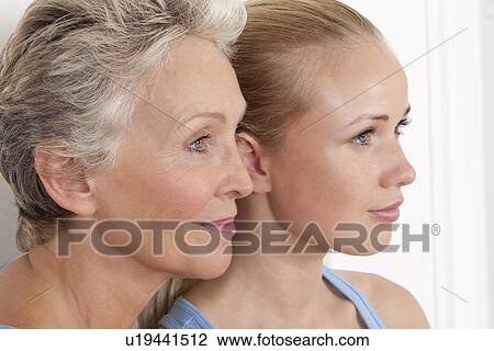 Mother and daughter smiling together View Large Photo Image Stock Image - Mother and daughter smiling together. Fotosearch