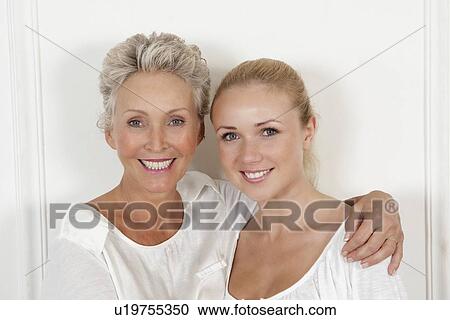 Mother and daughter smiling together View Large Photo Image Stock Image - Mother and daughter smiling together. Fotosearch