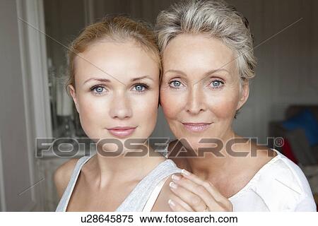 Stock Photography - Mother and daughter smiling together. Fotosearch