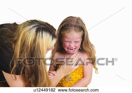 Mother comforting crying girl View Large Photo Image Stock Image - Mother comforting crying girl. Fotosearch