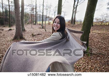 Older woman cheering in forest View Large Photo Image Stock Image - Older woman cheering in forest. Fotosearch