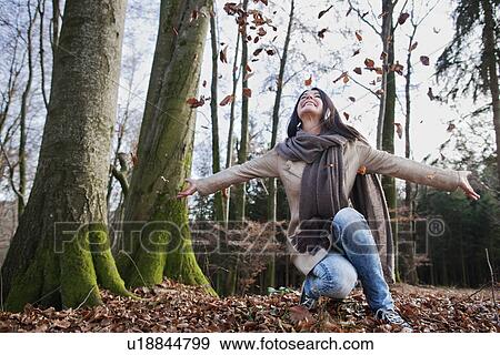 Older woman cheering in forest View Large Photo Image Stock Photo - Older woman cheering in forest. Fotosearch